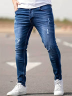 Herrenjeans Skinny-Jeans Fit mit Destroyed-Optik